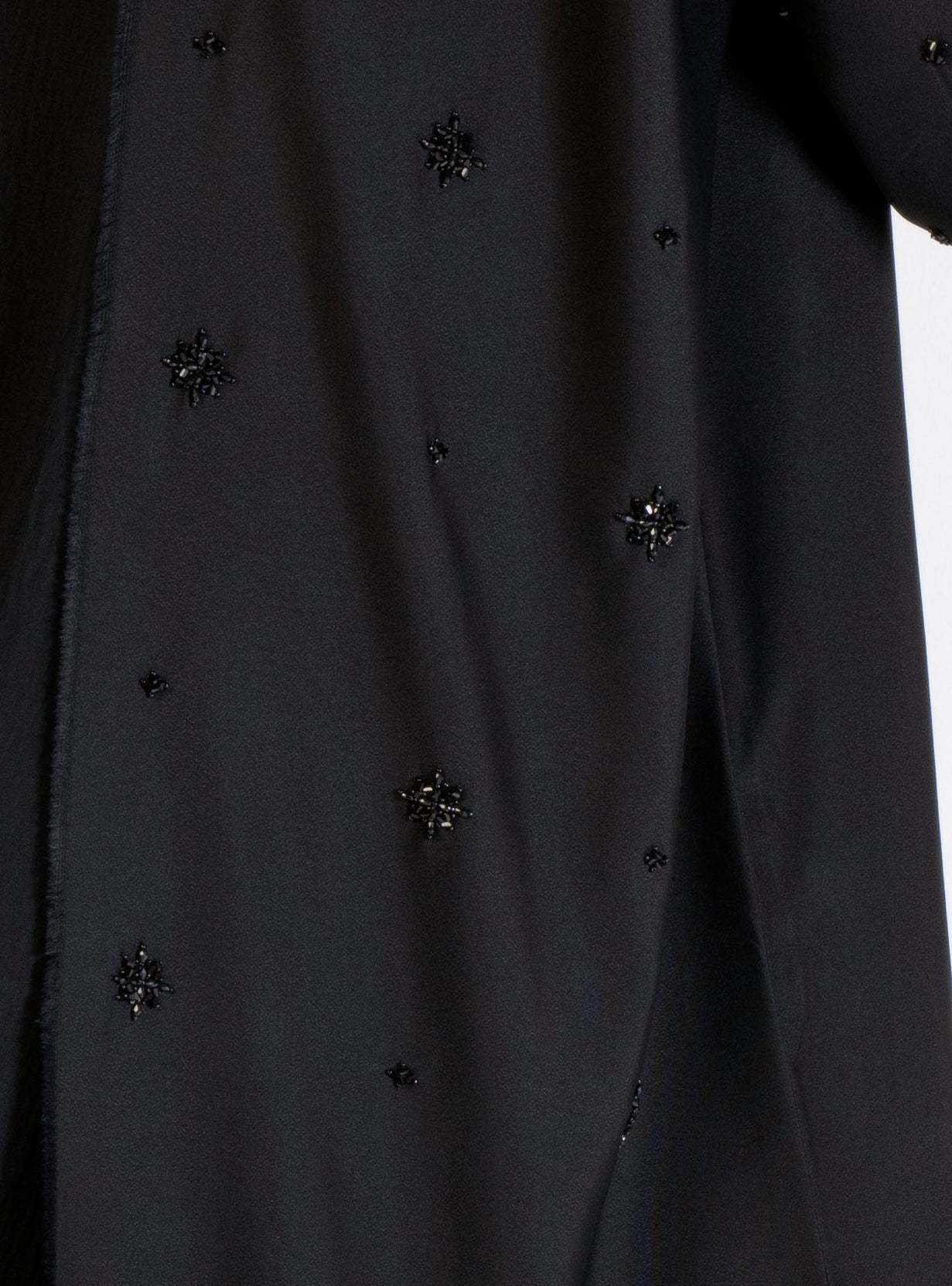 Motif bead work and fringes on front line of abaya