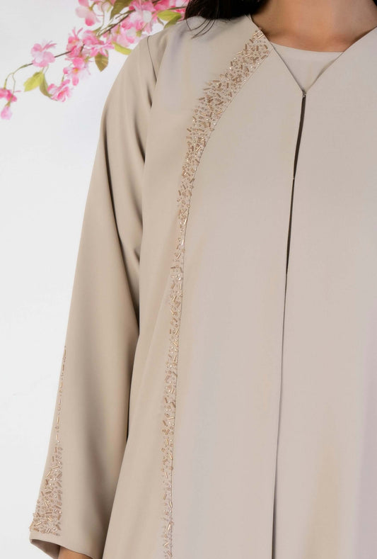 Beige Soft Fabric Abaya With Elegant Curve Line Pattern Bead Work On Front