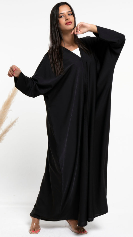 Girl wearing black Bahraini style abaya