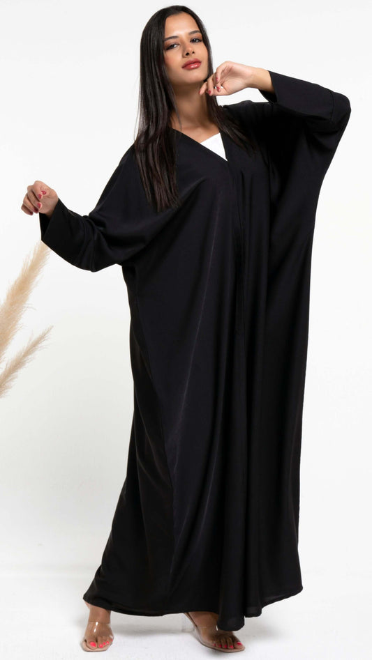 Girl wearing black Bahraini style abaya