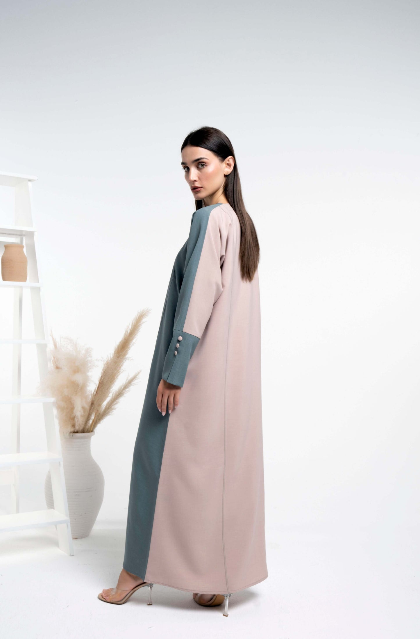 Girl wearing green & beige abaya