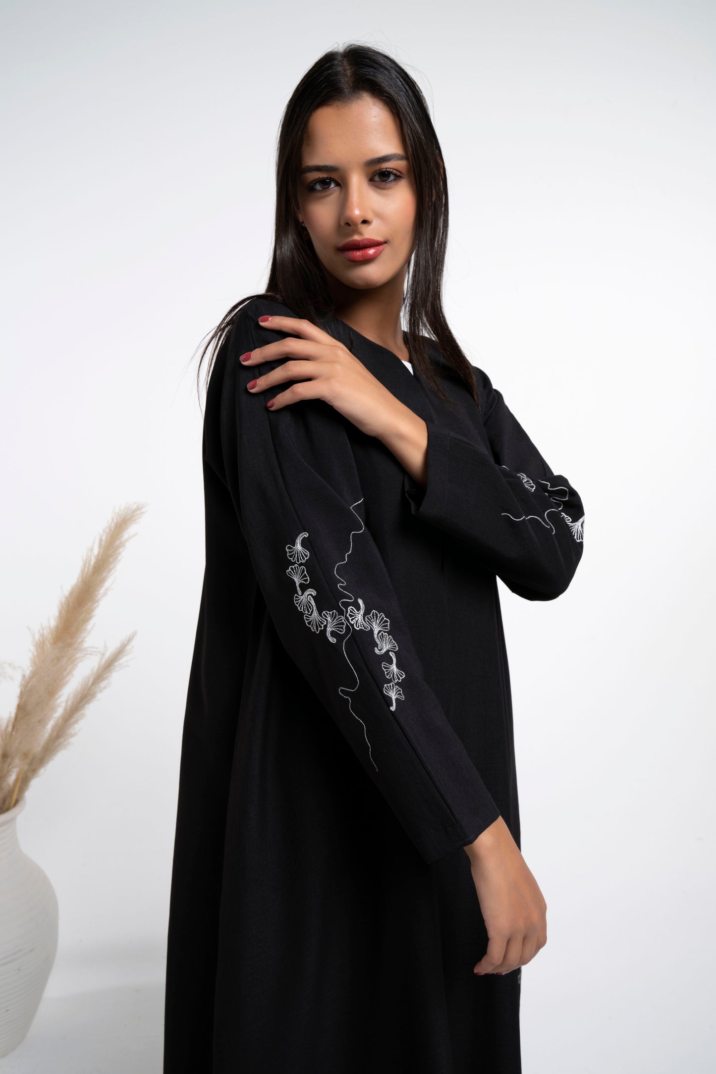 White floral embroidery on side and sleeves