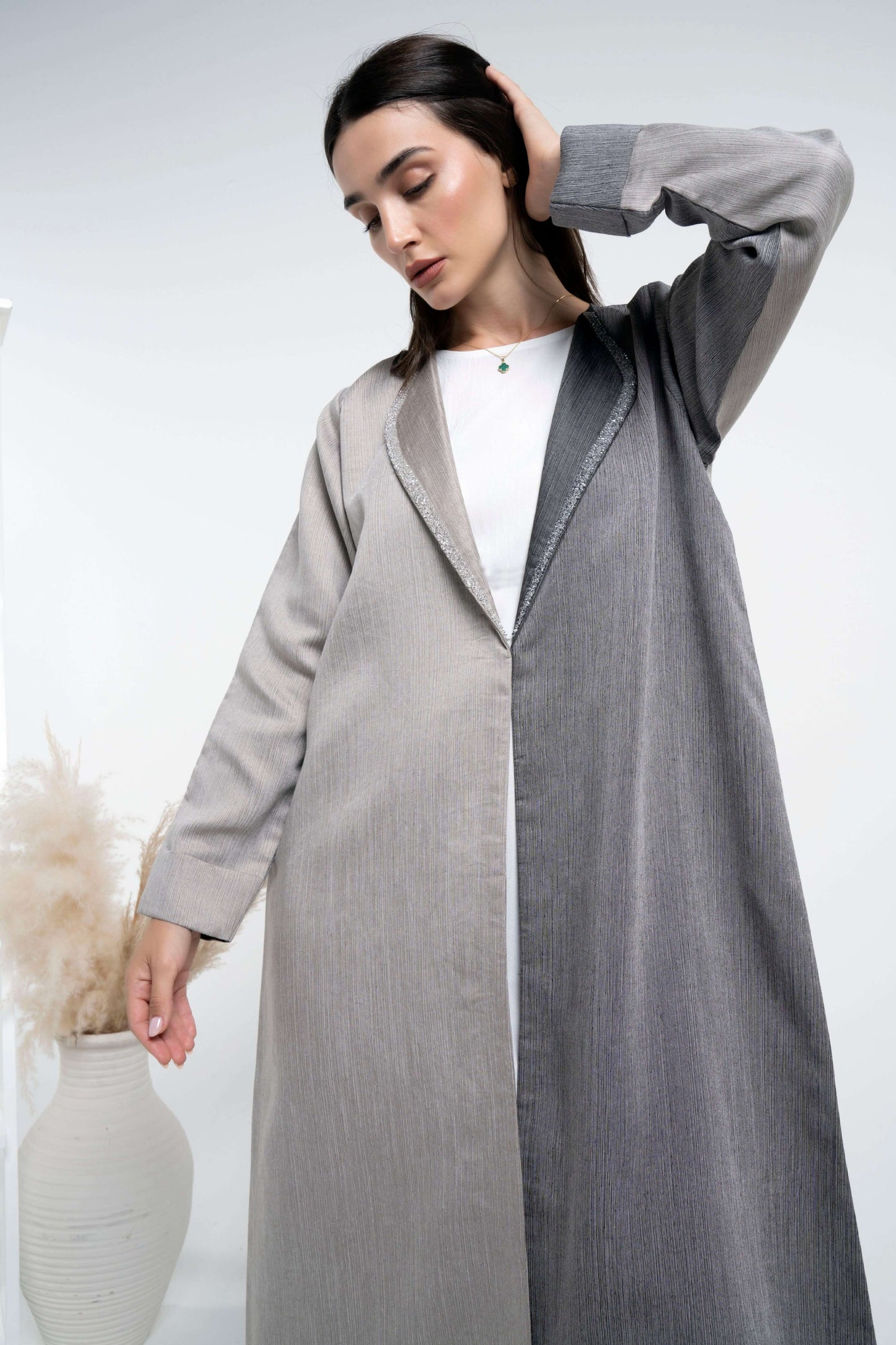 Detailed view of beige & grey color block abaya.
