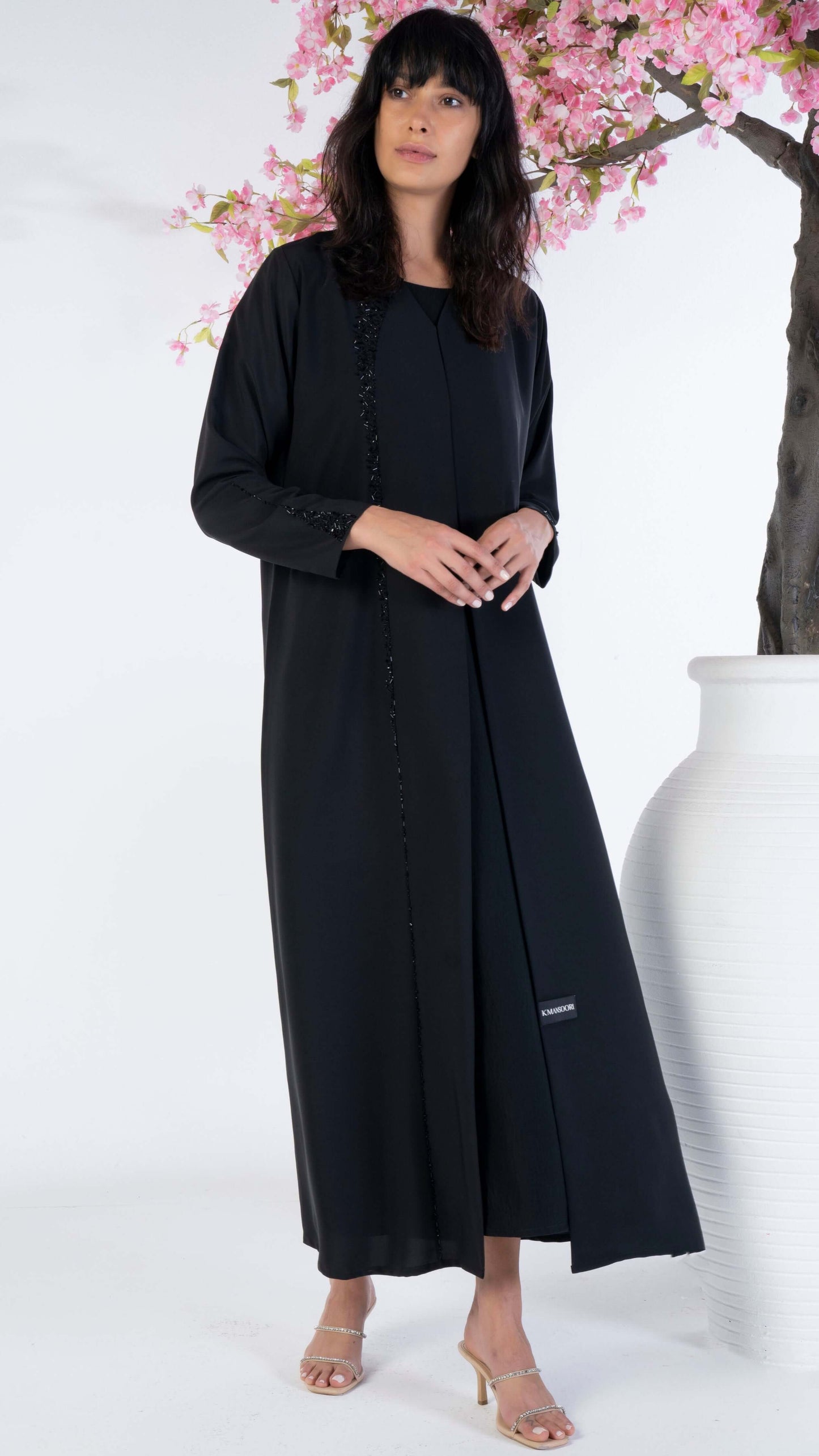 Soft fabric abaya with elegant curve line pattern bead work on front