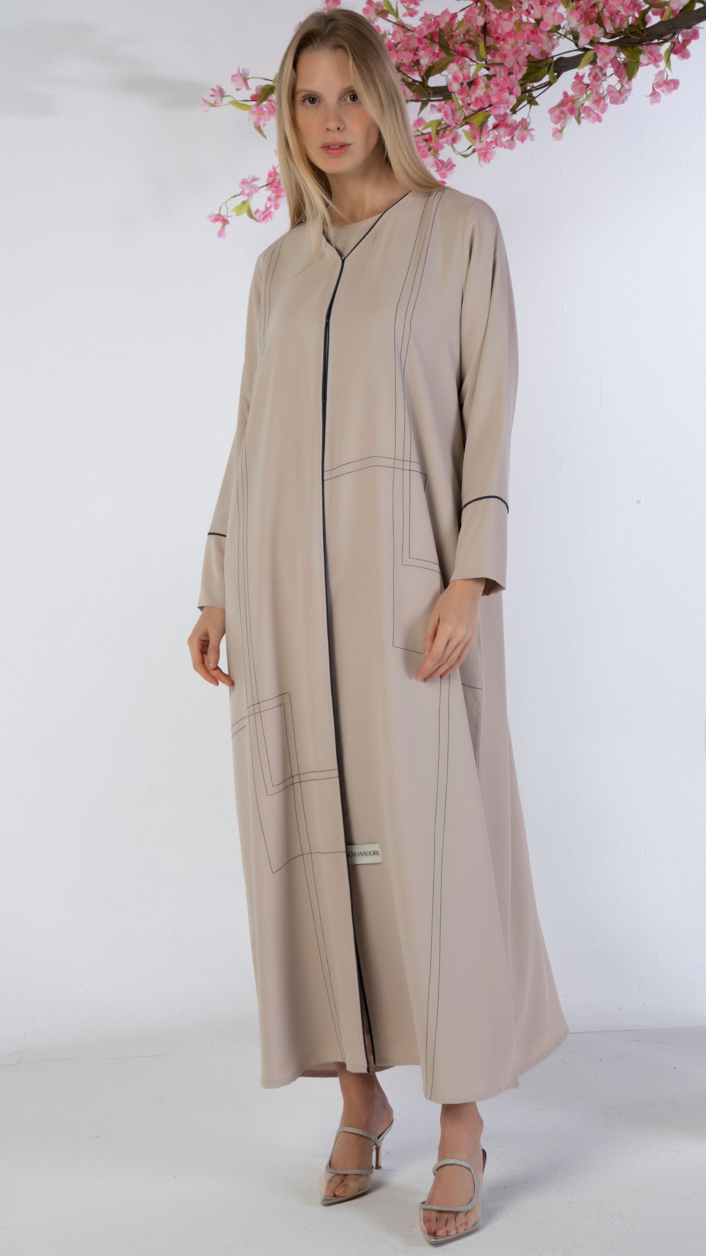 Beige abaya with blue color geometrical stitch line and piping