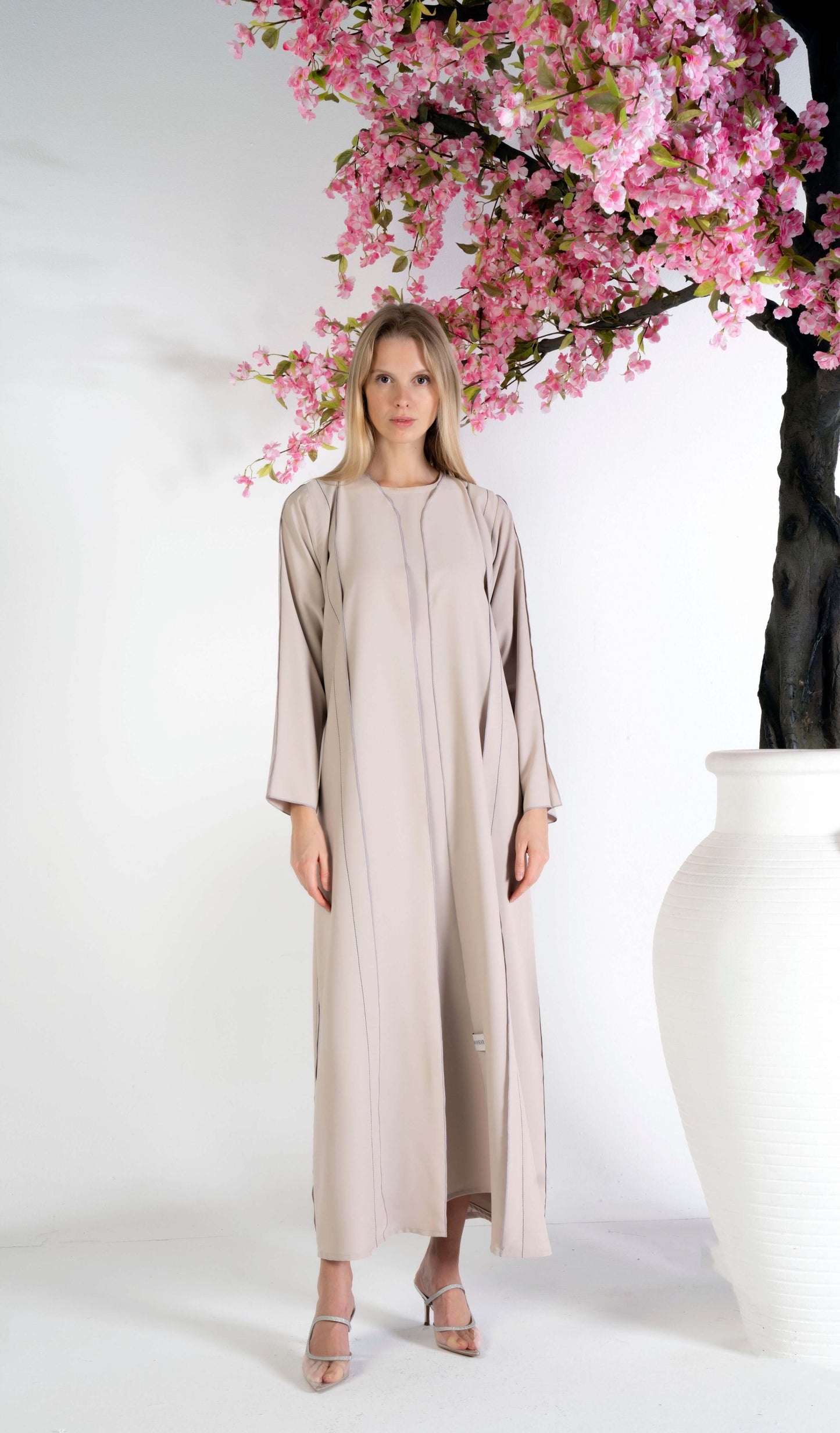 Beige abaya with contrast color stitch line