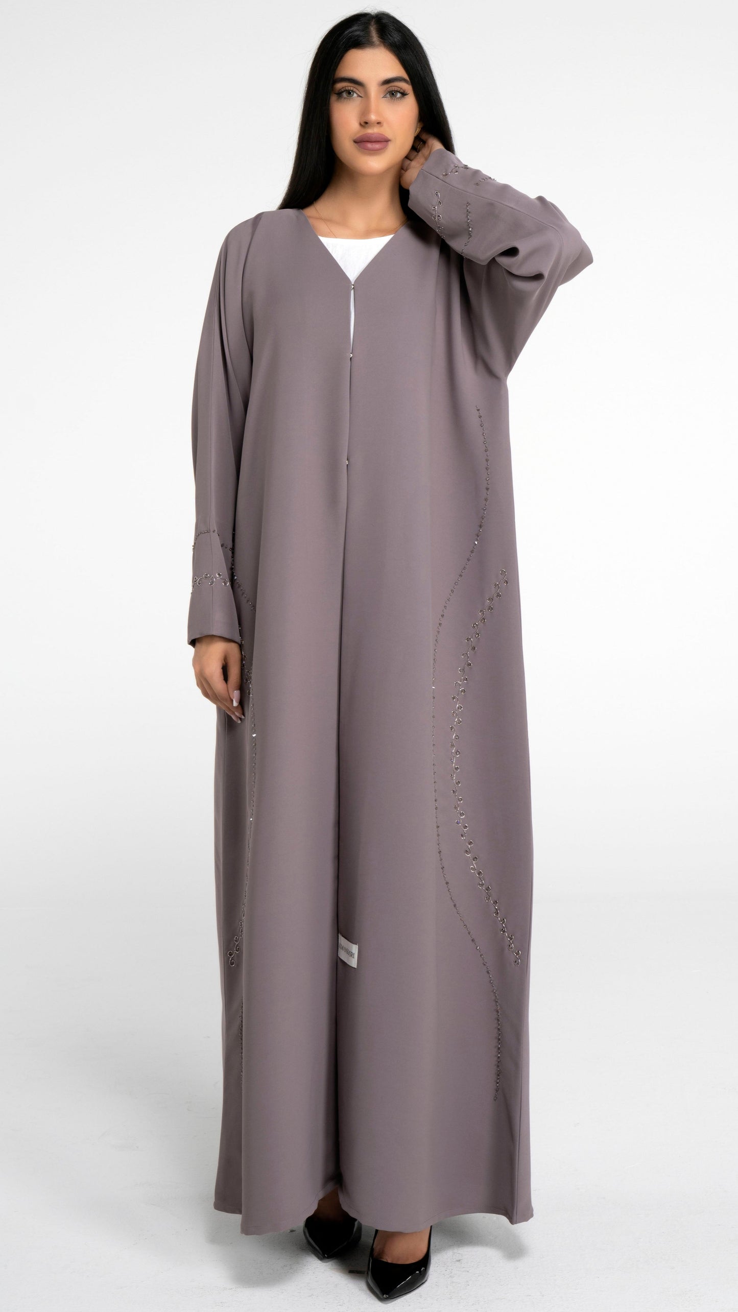 Brown color abaya with curve designed embellishment on front and sleeve