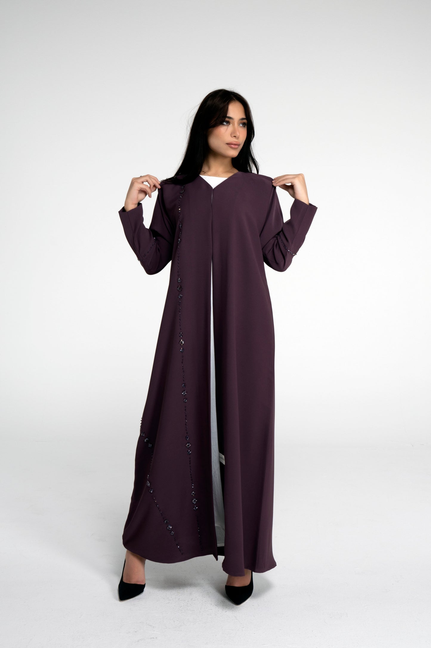 Full view of purple abaya with flower motif design line on front