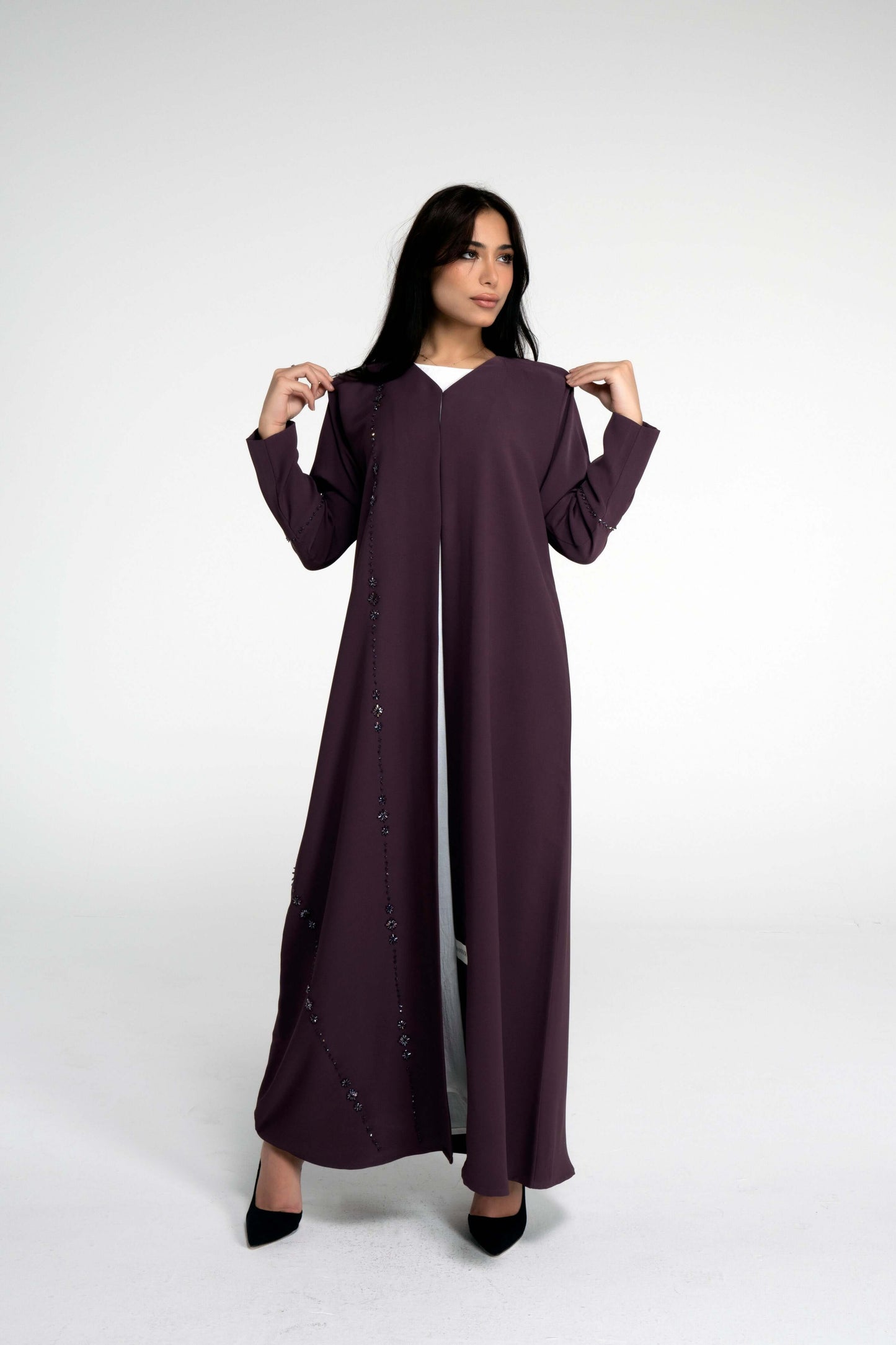 Full view of purple abaya with flower motif design line on front