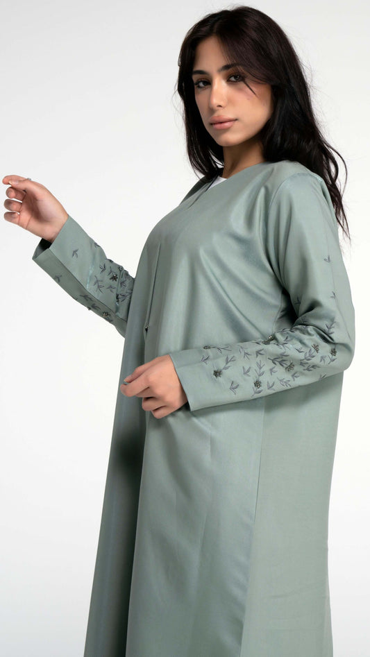 Floral embroidered sleeves with bead embellishments.