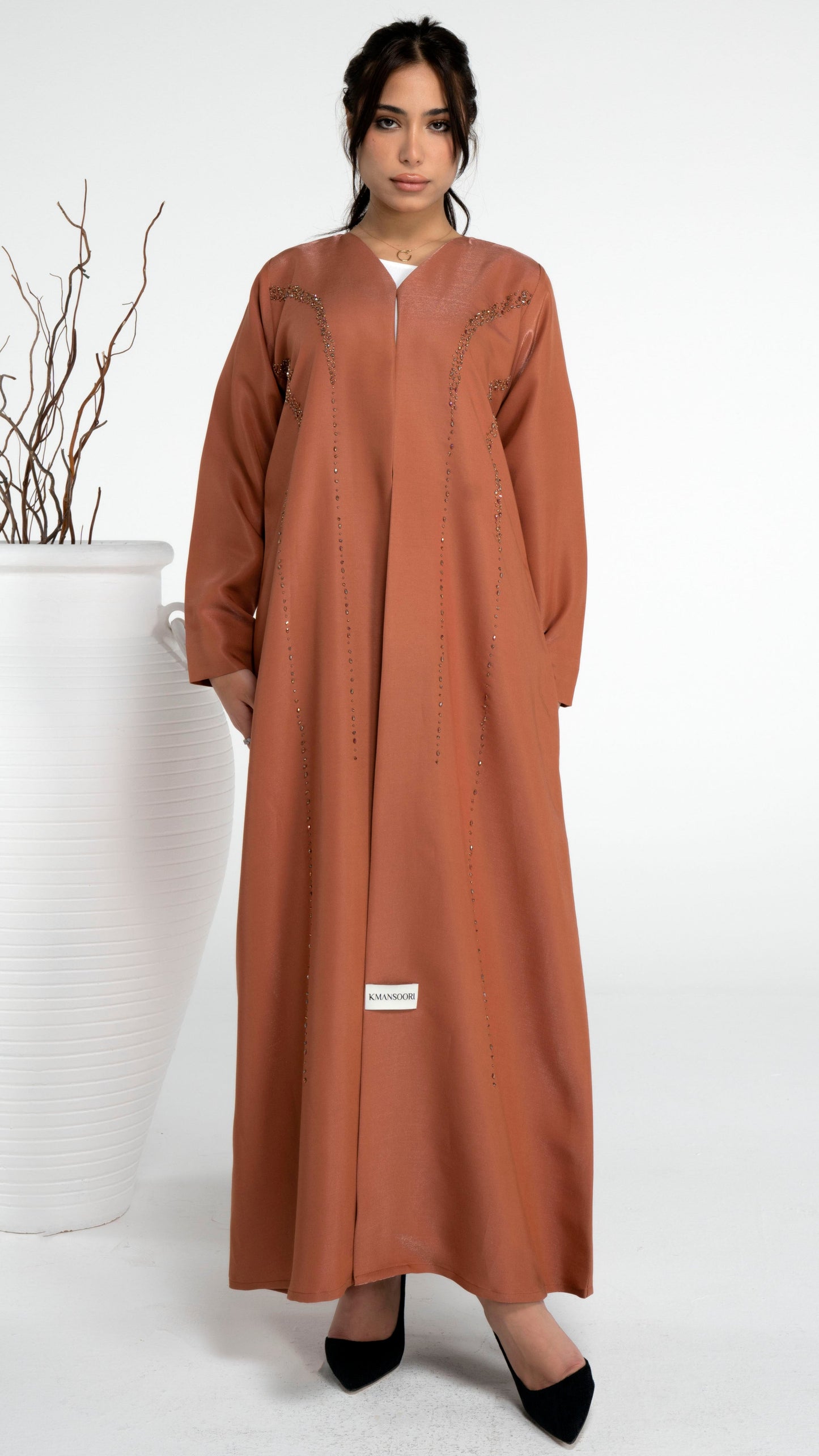 Orange abaya with princess line bead embellishments
