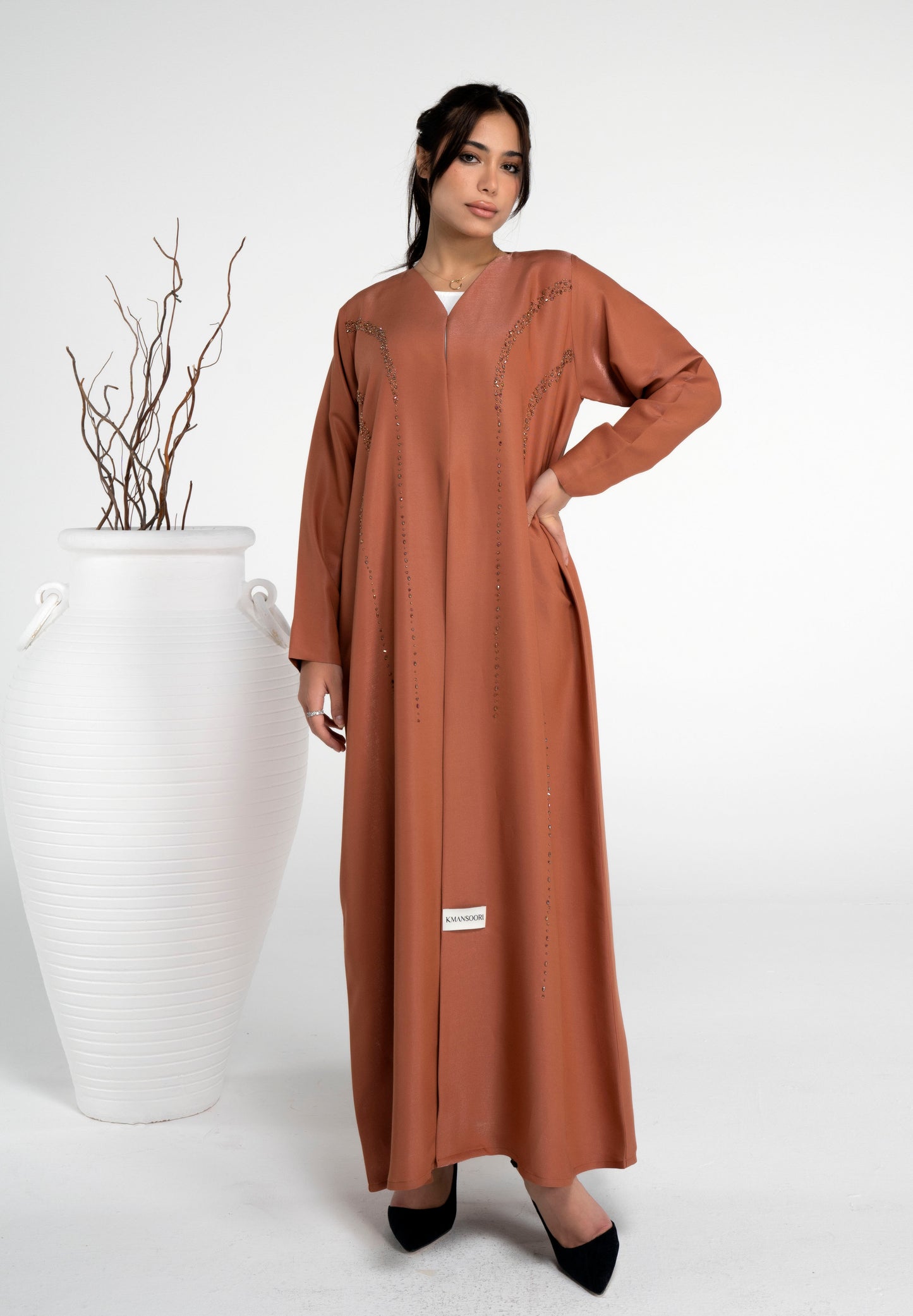 Girl wearing orange abaya