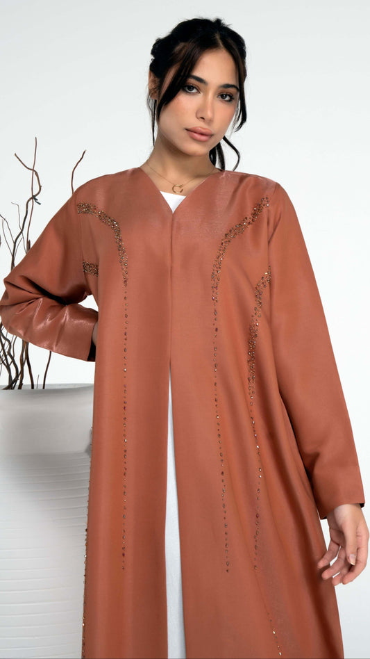 Princess line bead embellishments on orange colored abaya