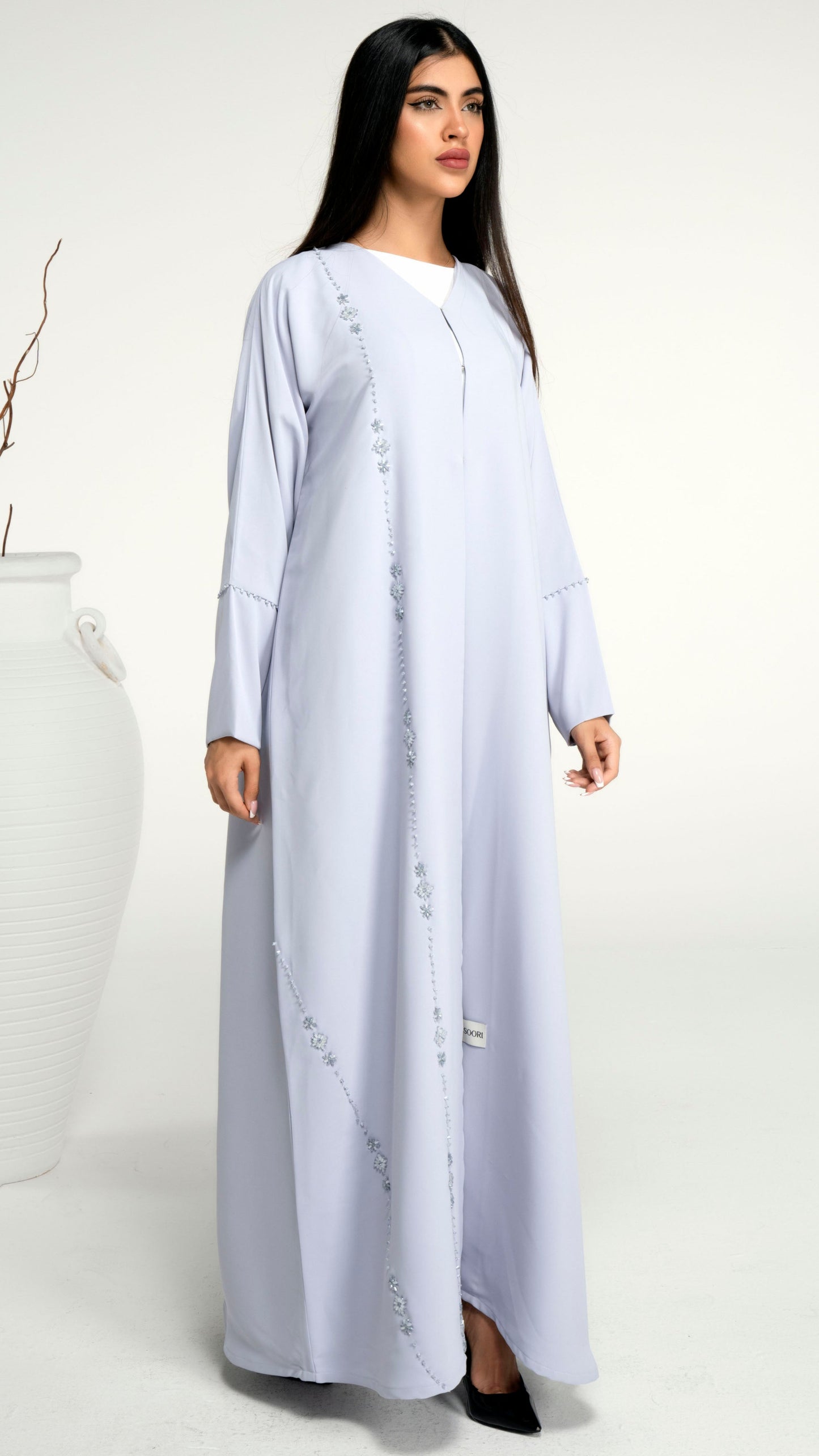 Light grey abaya with flower motif design line on front and bead line on sleeve