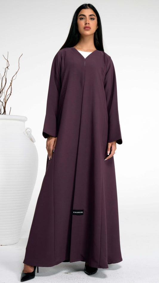 Girl wearing purple abaya with curve design cut sleeve