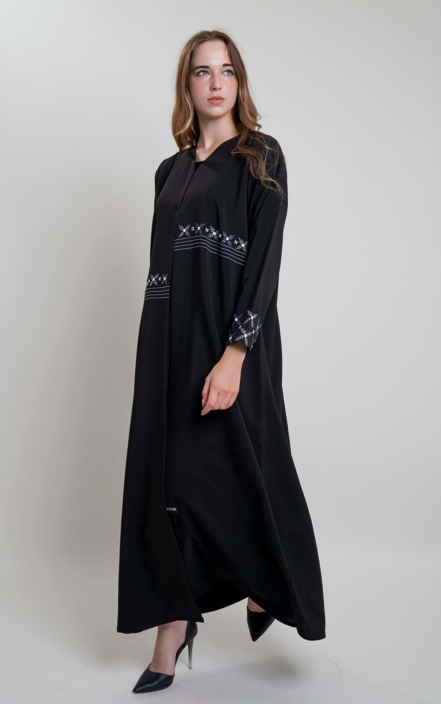 Black abaya with floral thread embroidery on front and fold sleeve.