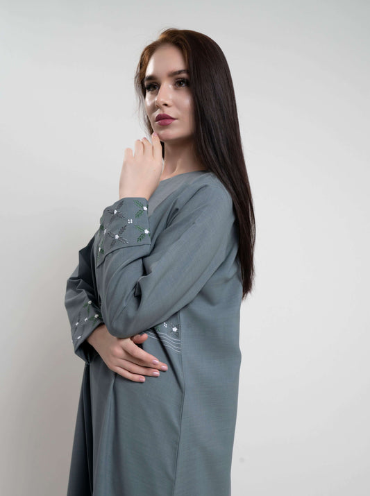 Floral thread embroidery on fold sleeve.