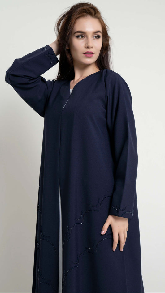 Dark blue abaya with curved bead embellishment on front and sleeve