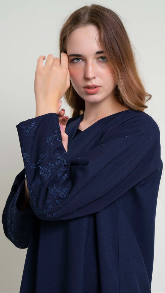 Thread embroidered sleeve with bead detailing.