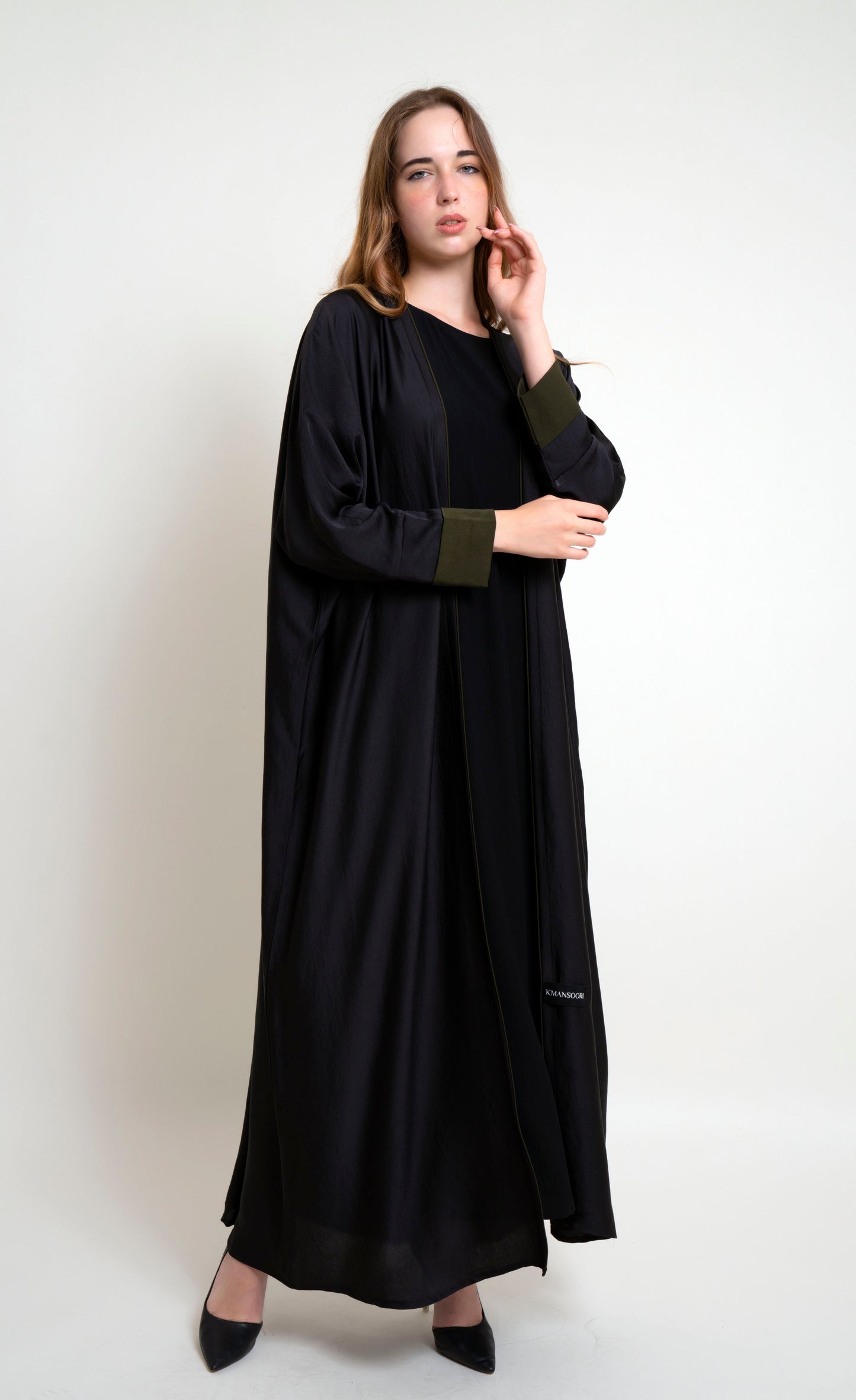 Girl wearing Bahrini Style Abaya With Green Cuff Sleeve