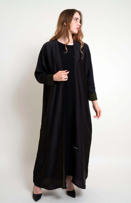 Girl wearing Bahrini Style Black Abaya With Green Cuff Sleeve