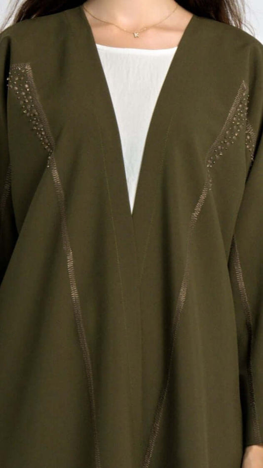 Detailed view of geometric patterned embroidery.