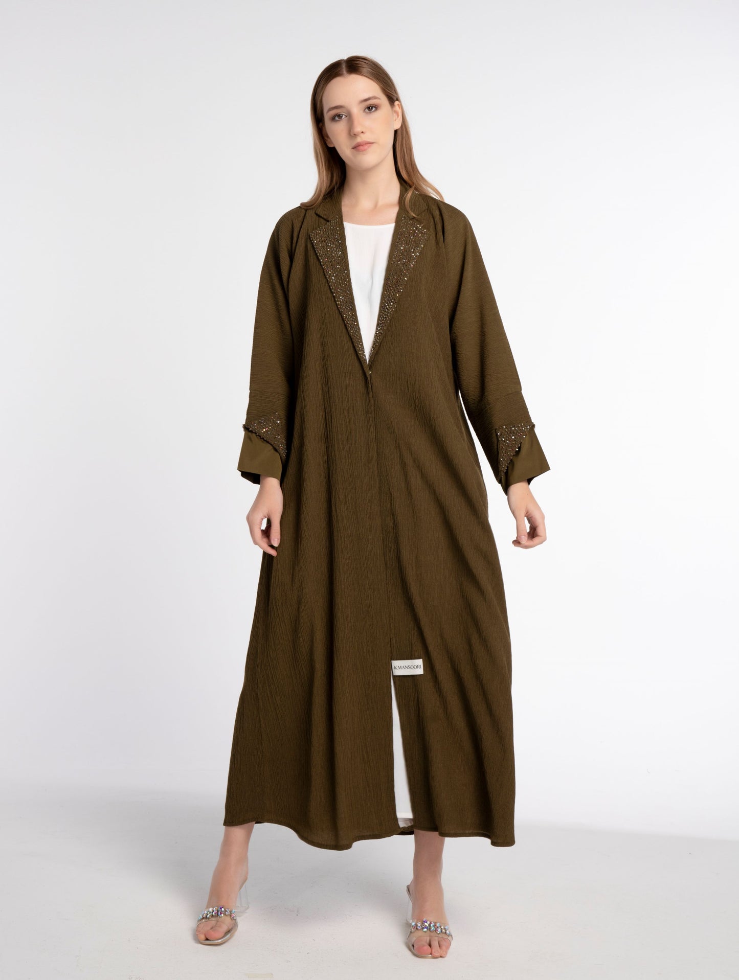 Girl wearing green abaya for women.