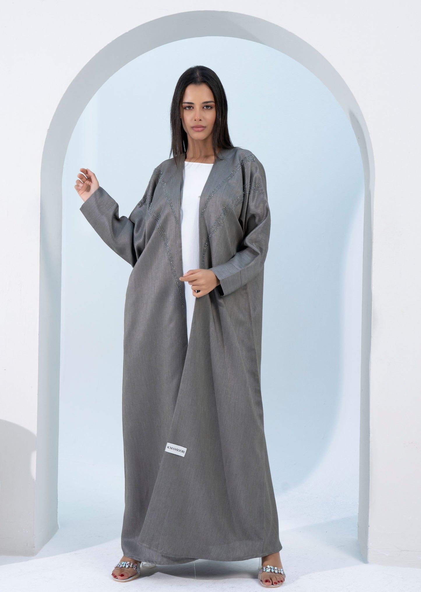 Girl wearing green bisht abaya.