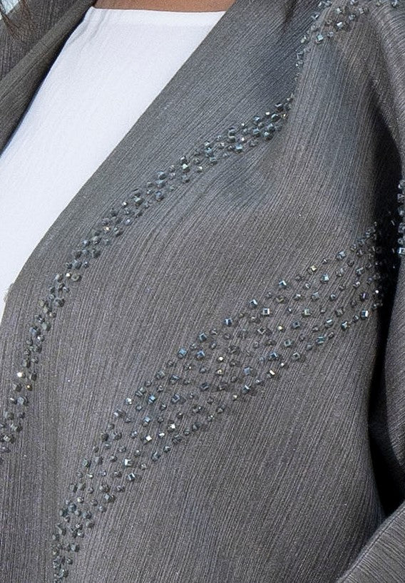 Embellishments on green bisht abaya
