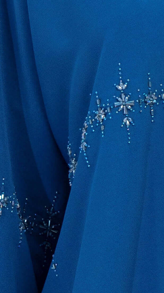 Star sparkling embellishments on sky blue colored abaya