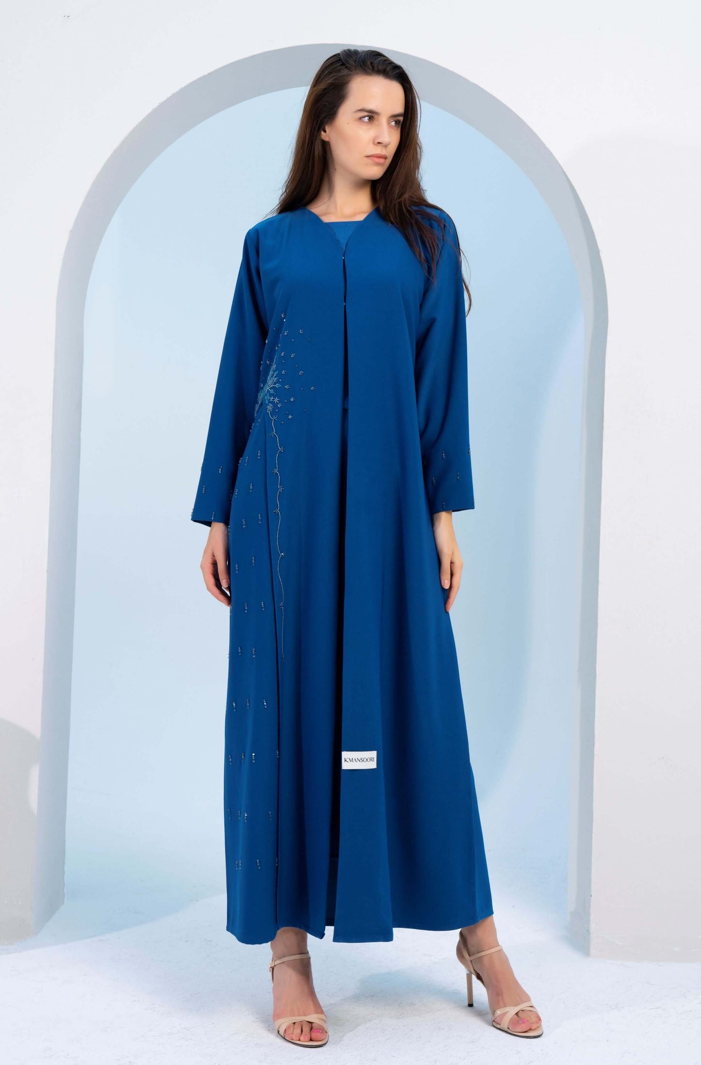 Girl wearing sky blue abaya for women.
