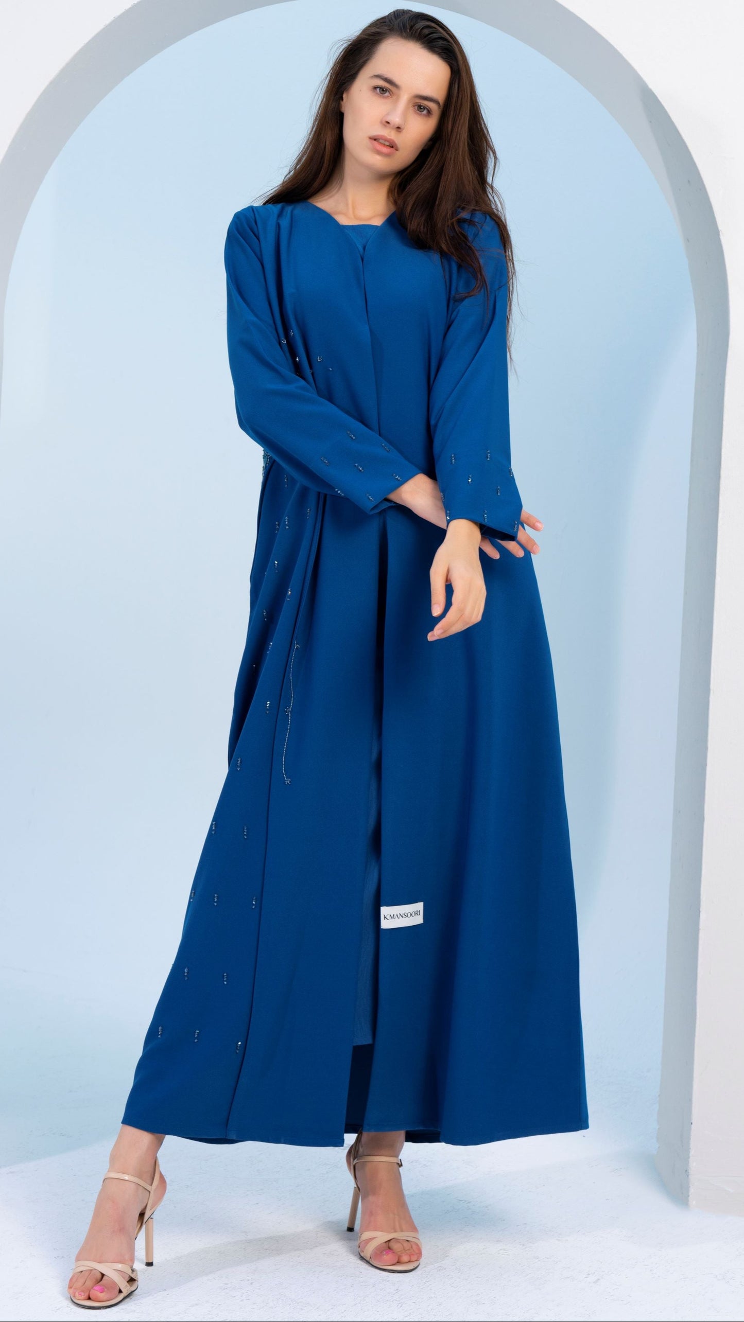 Sky blue V-neck abaya with embellishments on side and both sleeves.