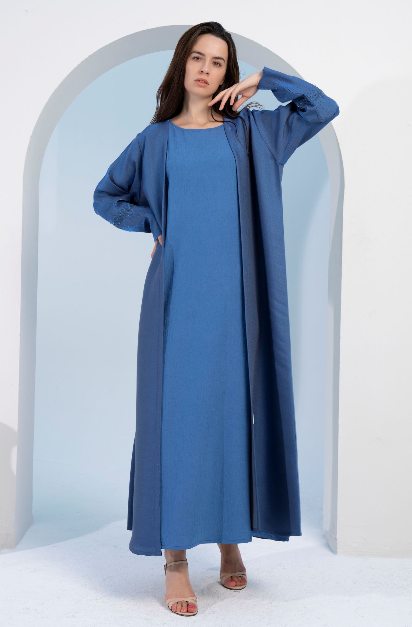 Sky blue colored bisht abaya with sparkling embellishments.