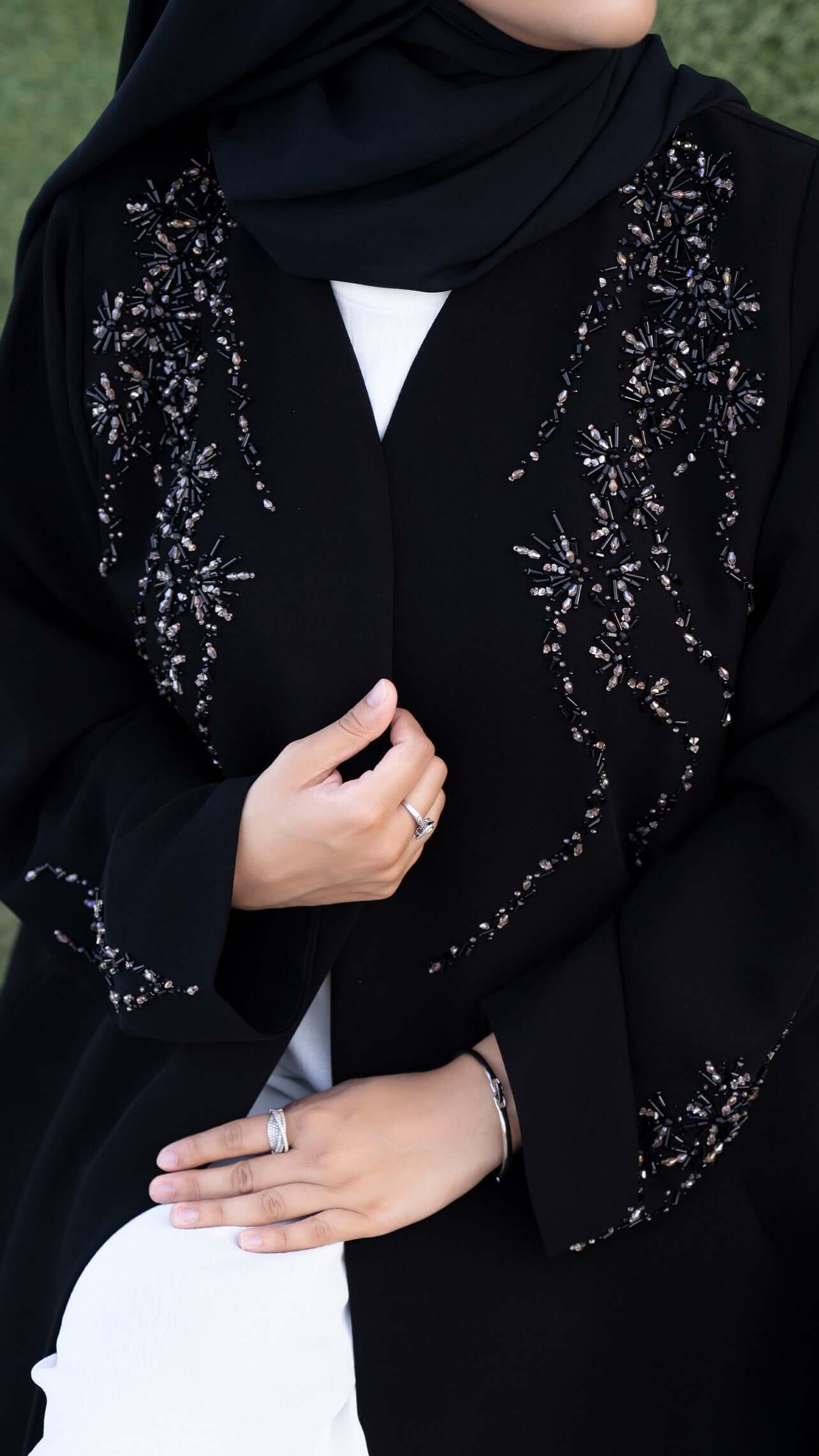 Women wearing Elegant black abaya with coloured bead detailing