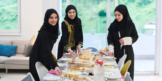 women putting food on the table