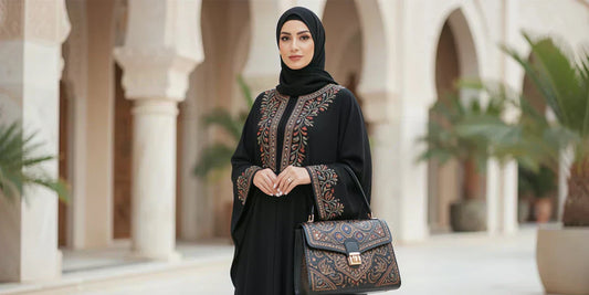 woman in abaya carrying a handbag
