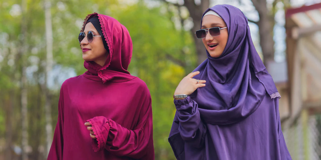 two women wearing abaya