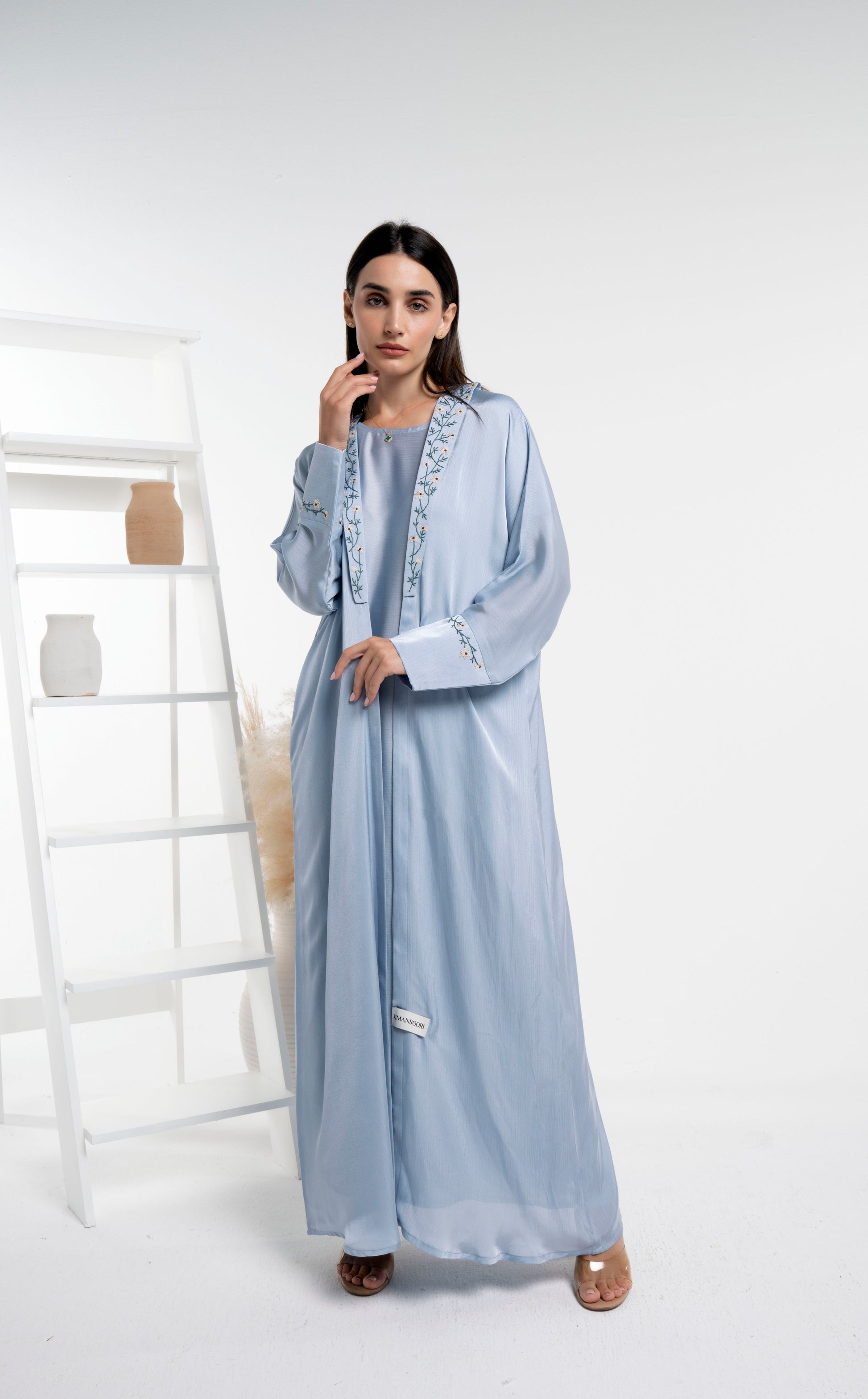 Girl wearing soft silk abaya with floral embroidery