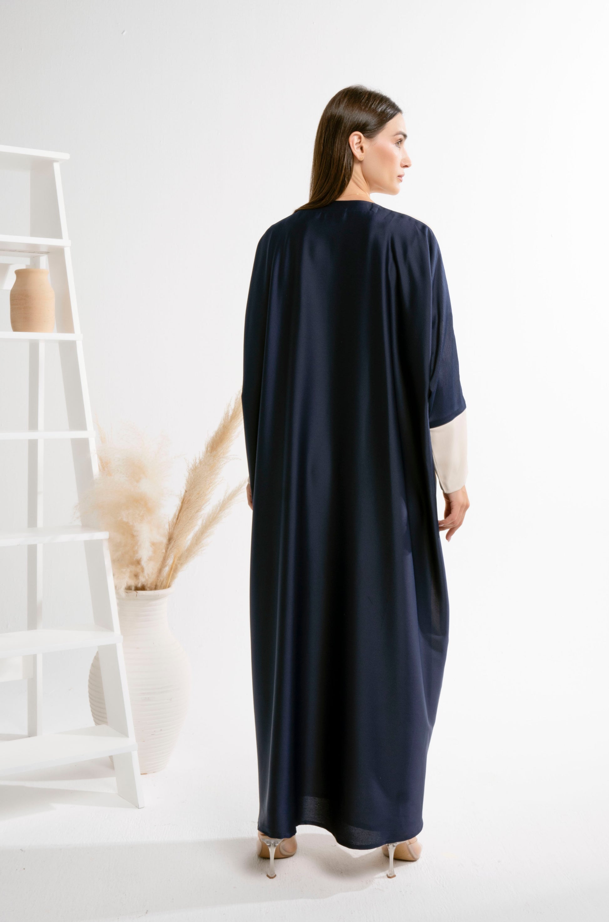 Back view of Bahraini style beige and blue color block abaya