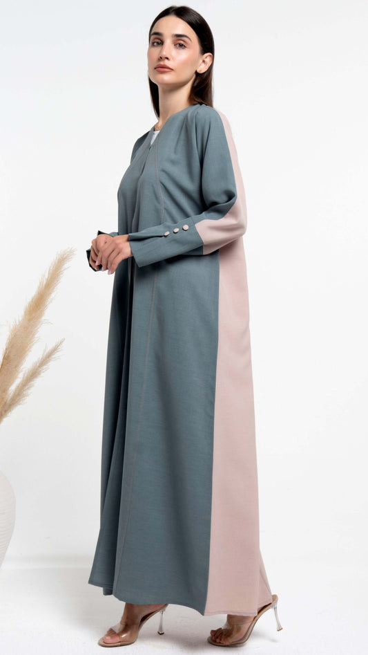 Side view of green & beige color abaya with curve stitch line on front and button detailing on sleeves for sale