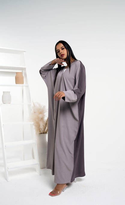 Girl wearing Bahraini style beige & brown color block abaya