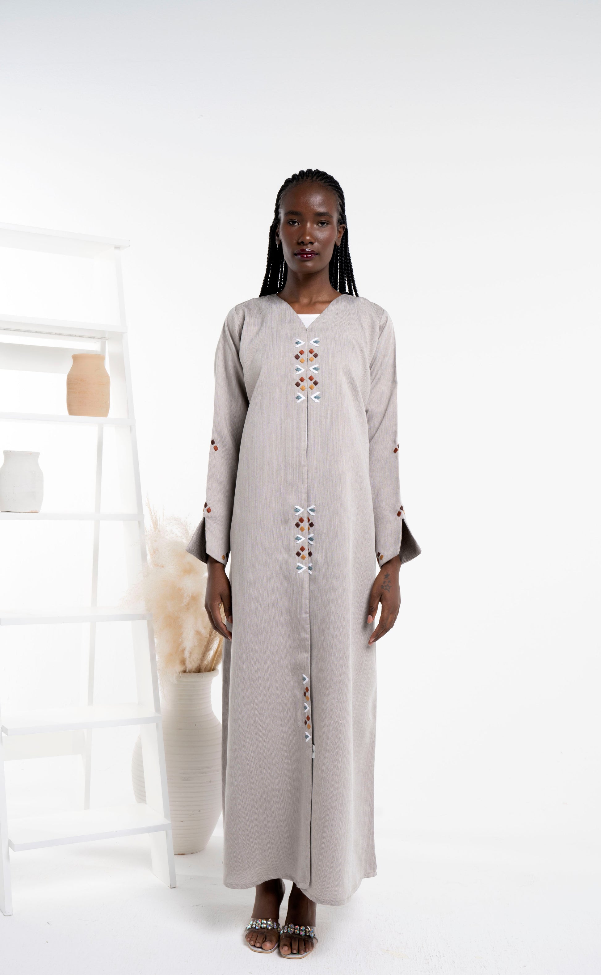 Beige color abaya with thread embroidery on frontline and sleeves