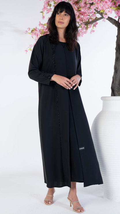 Soft fabric abaya with elegant curve line pattern bead work on front