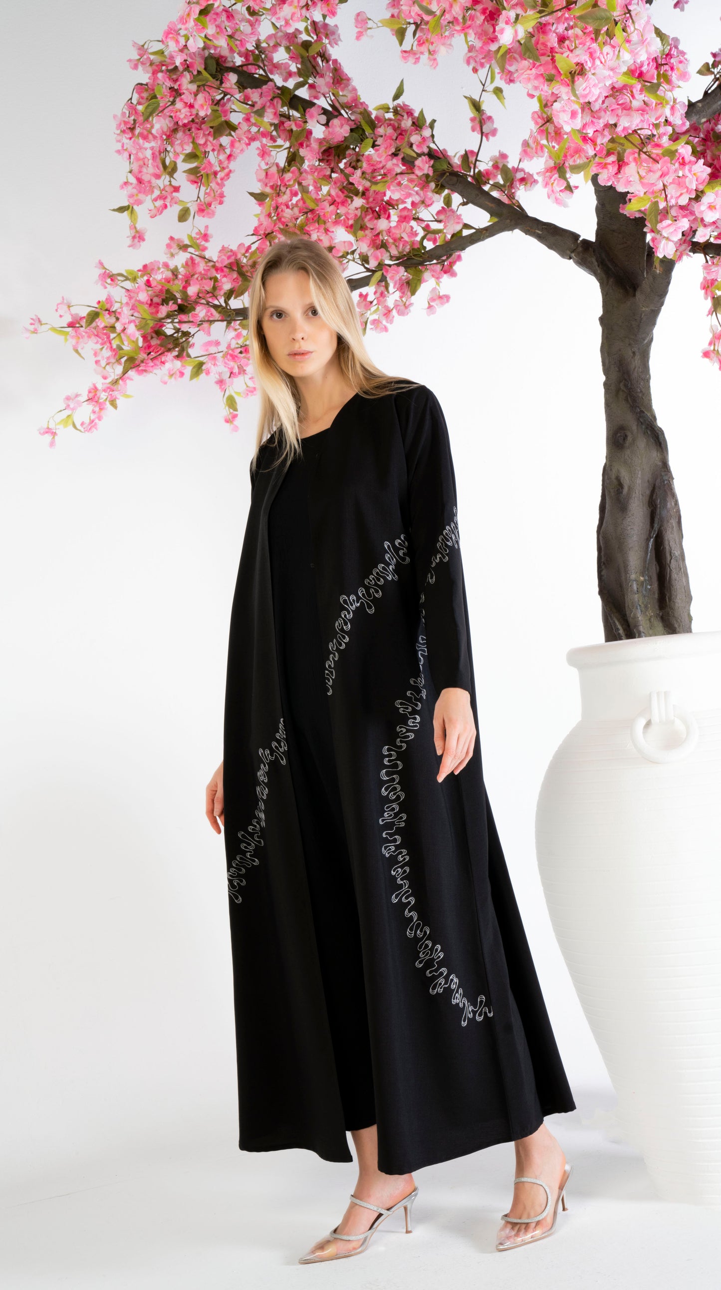 Elegant White Embroidery Detailing On Black Abaya