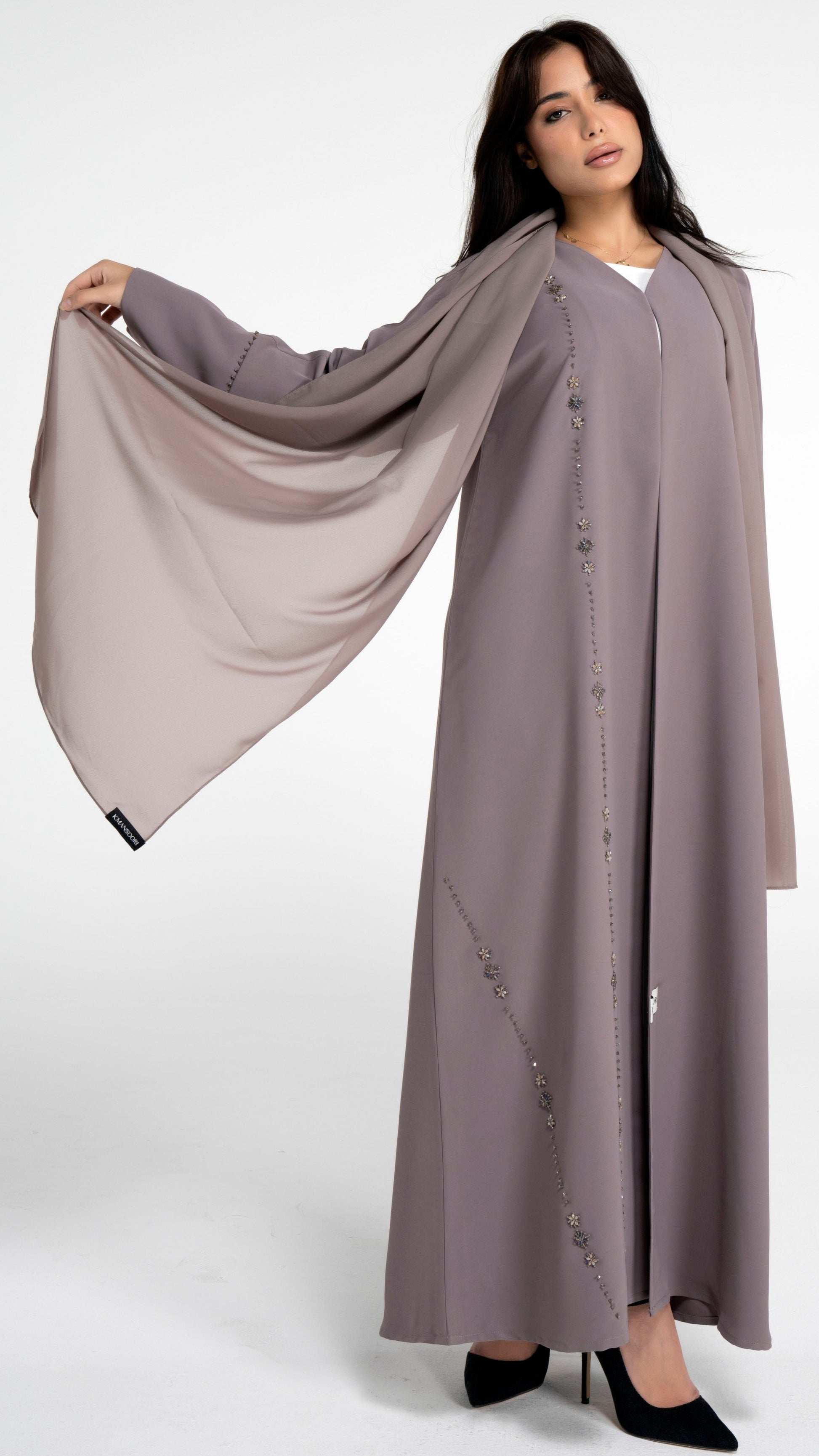 Brown abaya with flower motif design line.