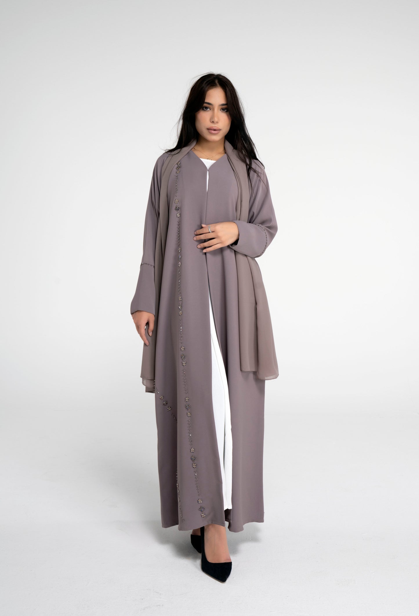 Brown abaya for women with flower motif design line on front and simple bead line on sleeve.