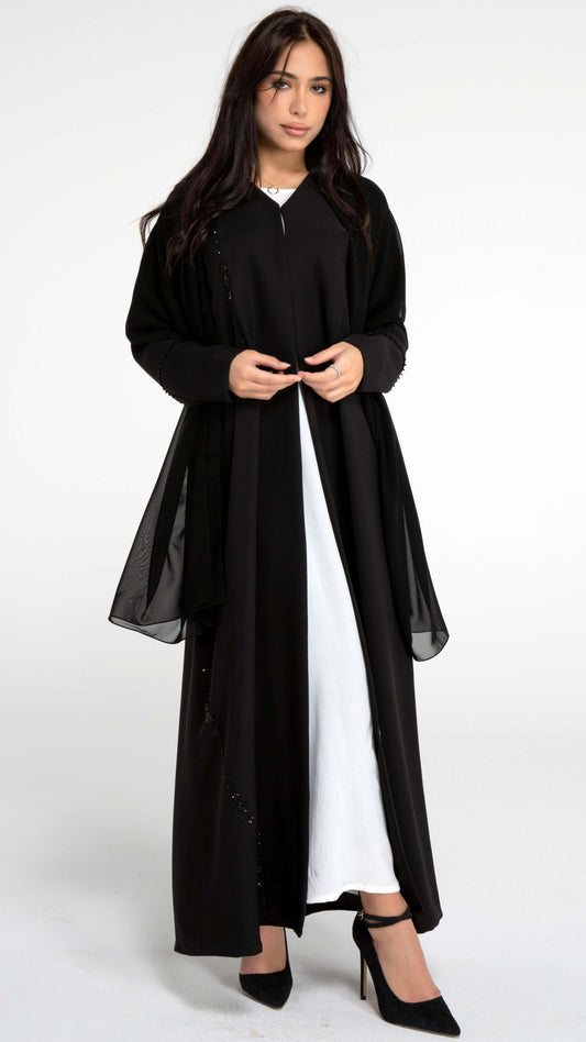 Girl wearing black abaya with flower motif design line