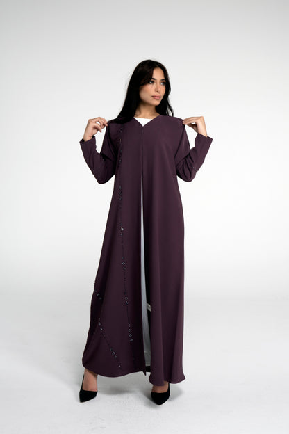 Full view of purple abaya with flower motif design line on front