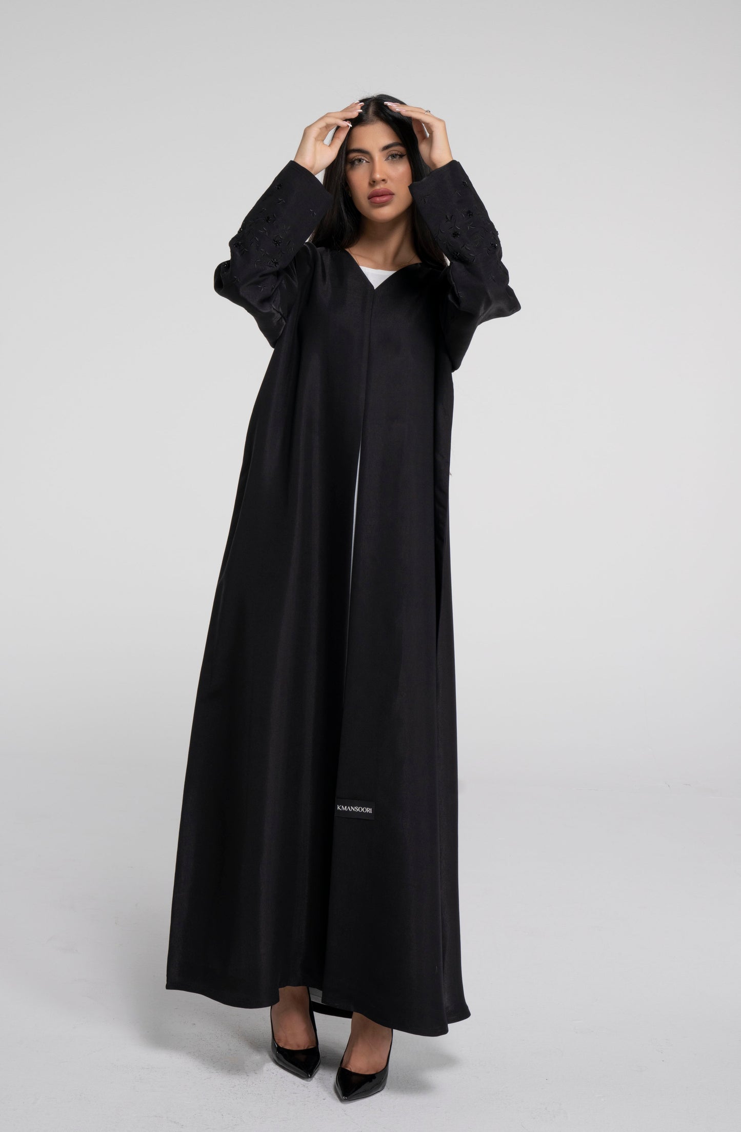 Floral embroidered sleeve with bead embellishments on black abaya