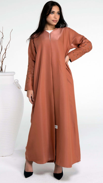 Orange colored abaya with floral thread embroidery sleeve with bead embellishments